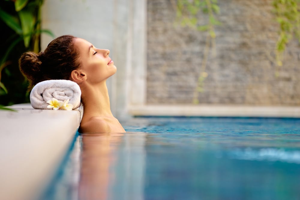 Young Woman Relaxing In Spa Swimming Pool